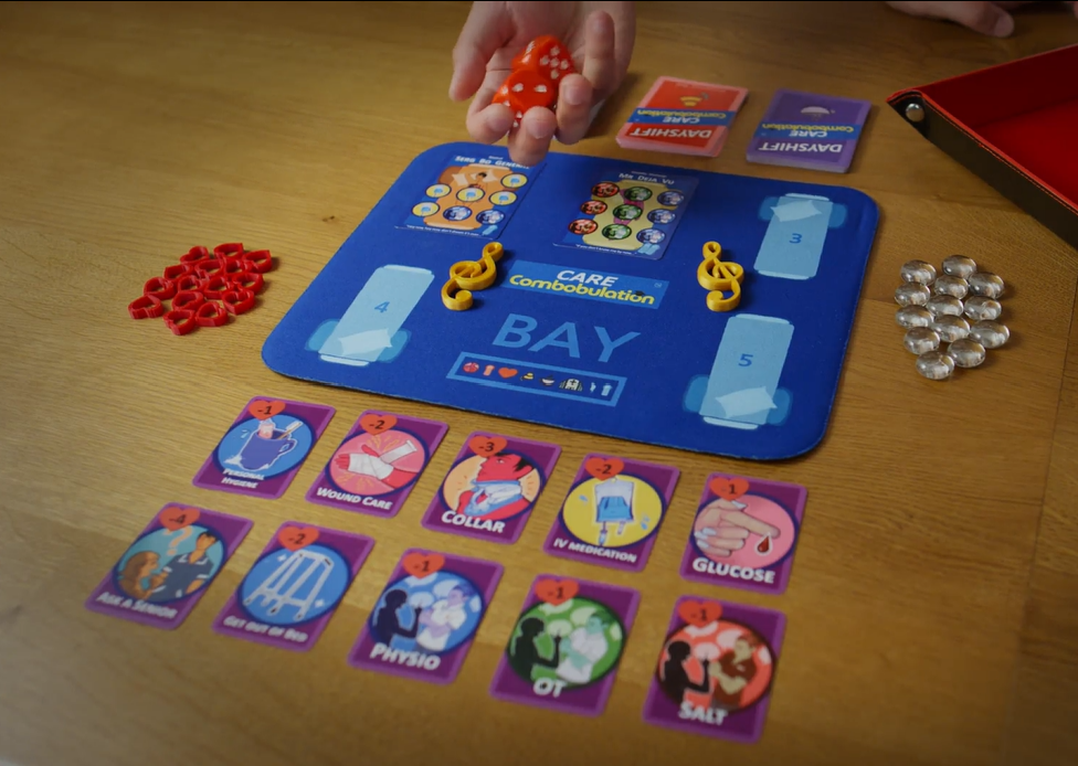 Dayshift bay board, patient cards, care cards, dice and counters ready for play