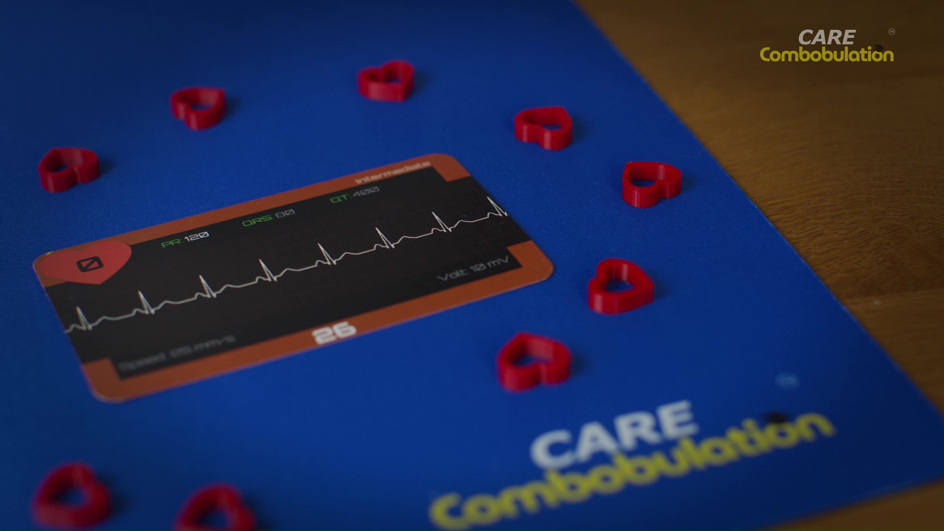 An ECG Race rhythm card surrounded by red heart counters