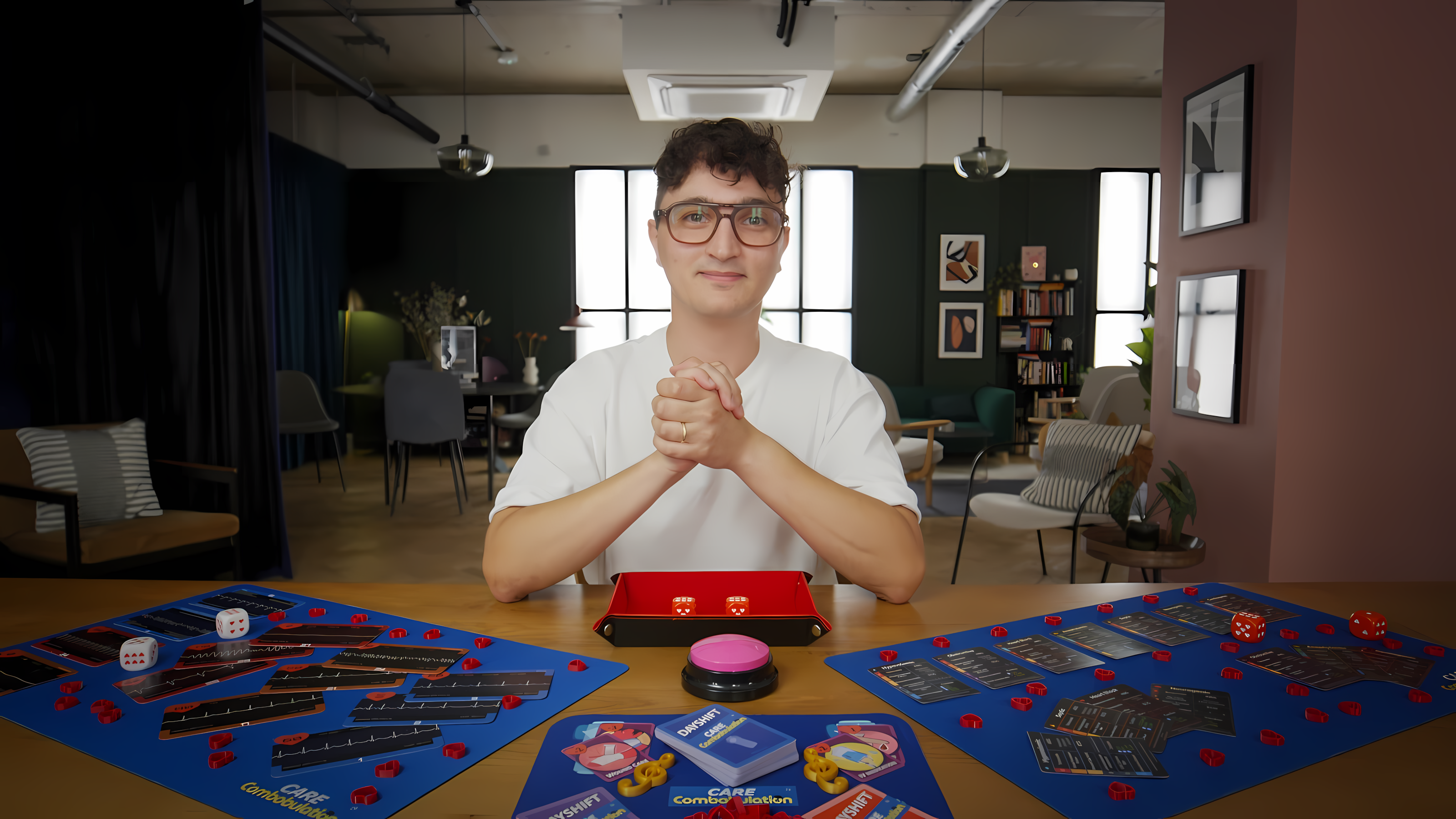 Emanuele with the CareCombobulation games arranged on the table